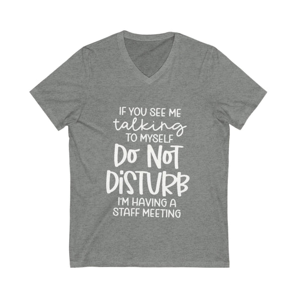 Gray t-shirt with white text on a white background