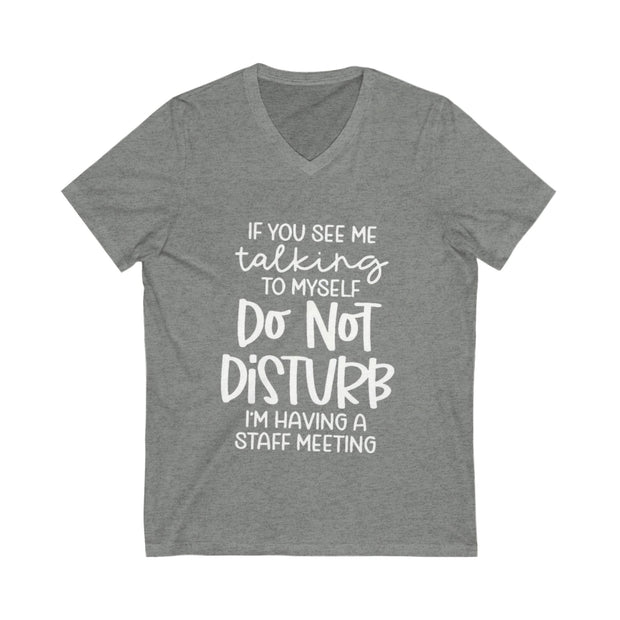 Gray t-shirt with white text on a white background