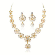 Pearl necklace and earrings set on a white background