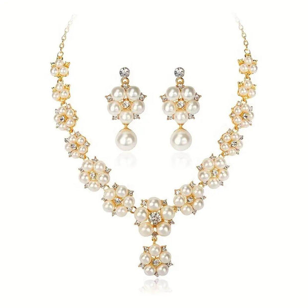 Pearl necklace and earrings set on a white background