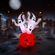 Halloween-themed inflatable decoration with ghosts and a pumpkin in a graveyard setting.