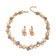 Pearl necklace and earrings set on a white background