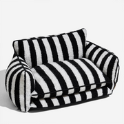 Black and white striped pet bed on a white background