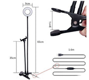 Measurement chart of a stand with lamp and clamps on a white background