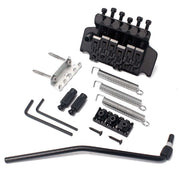 Guitar bridge assembly with components on a white background