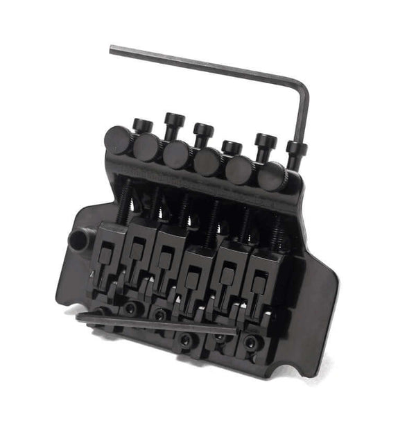 Black guitar bridge with a wrench on a white background