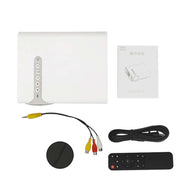 White electronic device with cables and remote control on a white background
