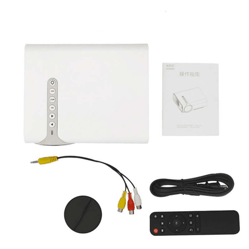 White electronic device with cables and remote control on a white background