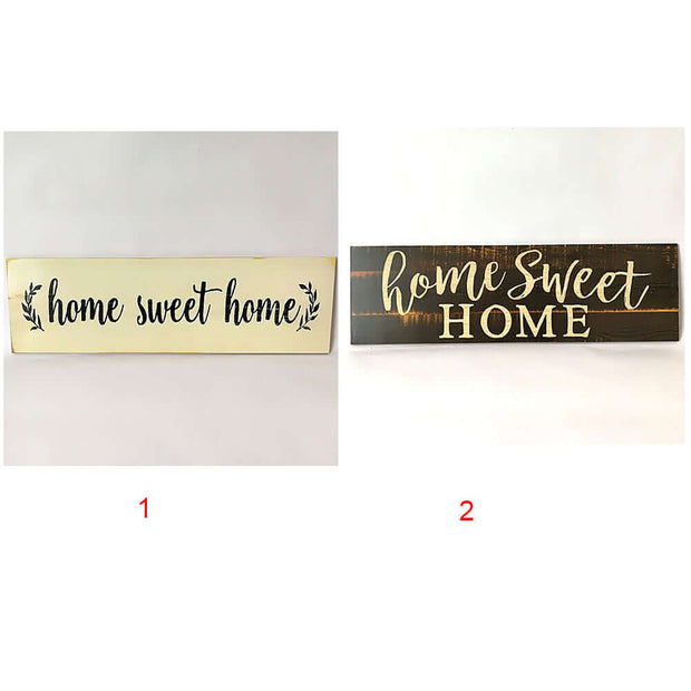 Two 'home sweet home' signs, one gold and one black, on a white background.