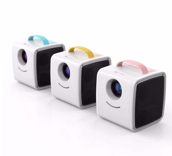 Three small cube-shaped devices with colorful handles on a white background