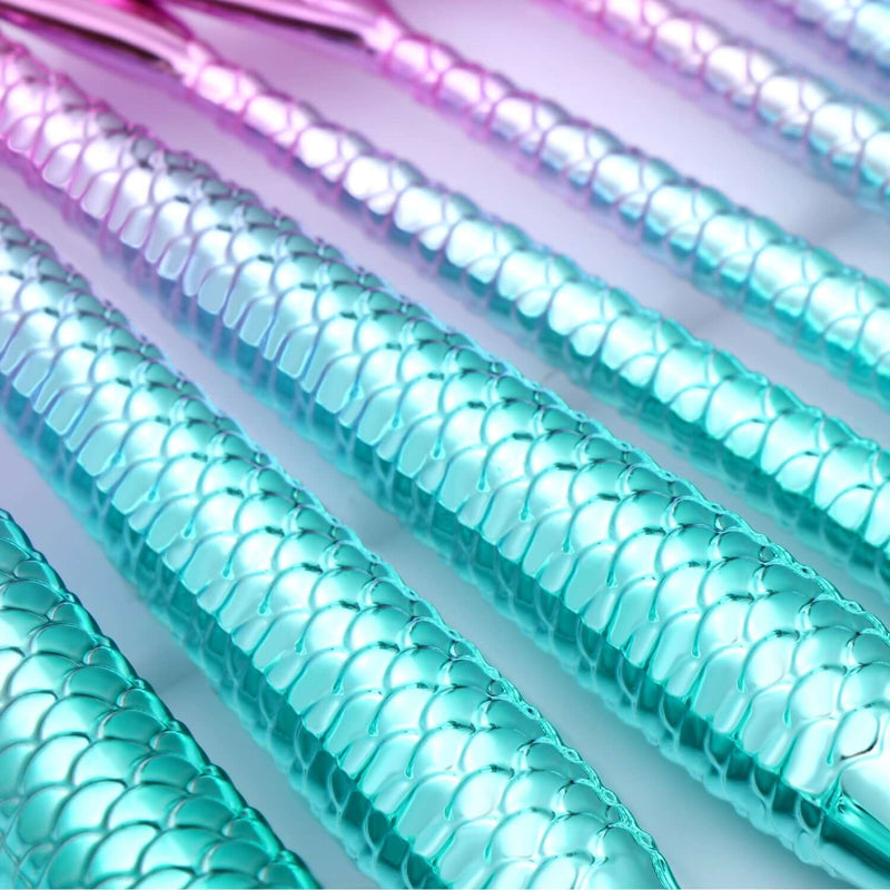 Mermaid scale patterned straws in turquoise, pink, and purple on a white background