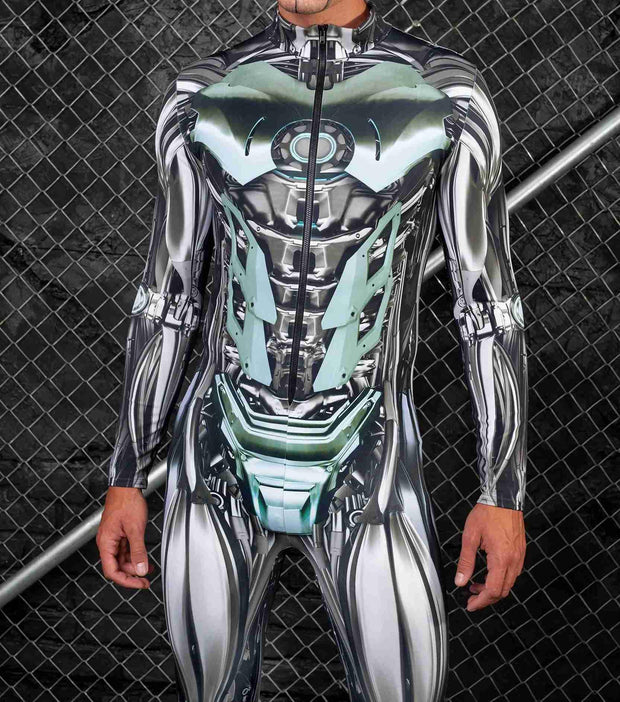 Person wearing a futuristic, reflective bodysuit with green accents against a chain-link fence background.