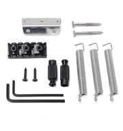 Set of guitar bridge components including springs, screws, and metal brackets on a white background