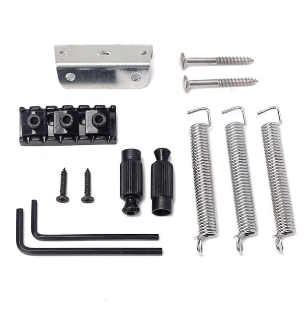 Set of guitar bridge components including springs, screws, and metal brackets on a white background