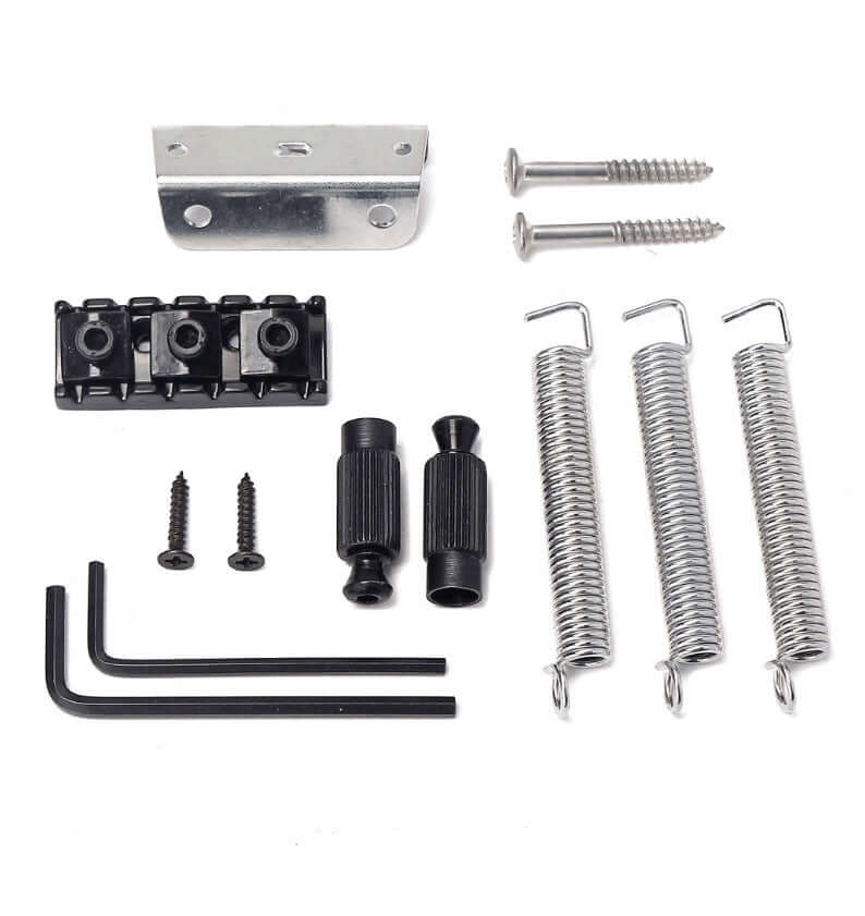Set of guitar bridge components including springs, screws, and metal brackets on a white background