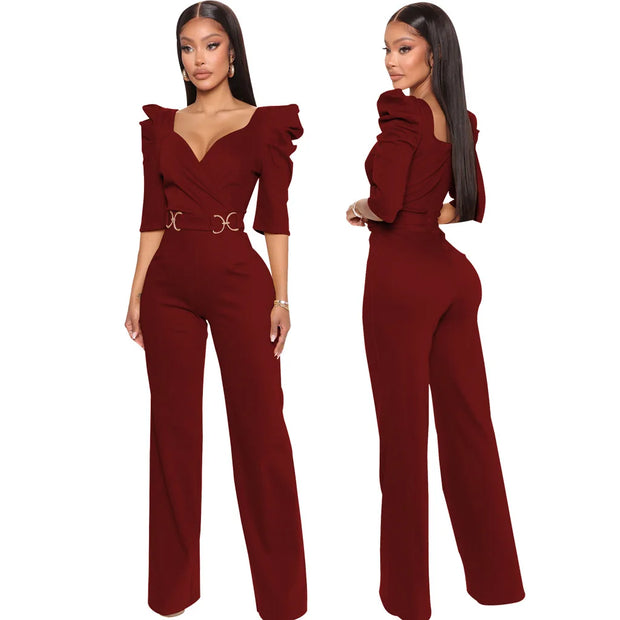 Red jumpsuit worn by a model on a white background
