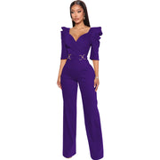 Purple jumpsuit with ruffled sleeves on a white background