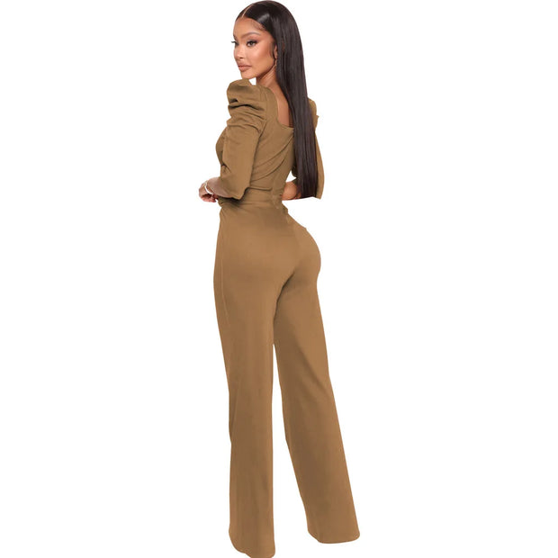 Woman wearing a brown jumpsuit on a white background