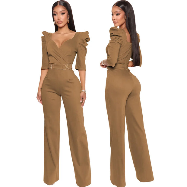 Brown jumpsuit worn by a model on a white background