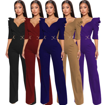 Five women wearing jumpsuits in black, red, blue, brown, and purple on a white background.