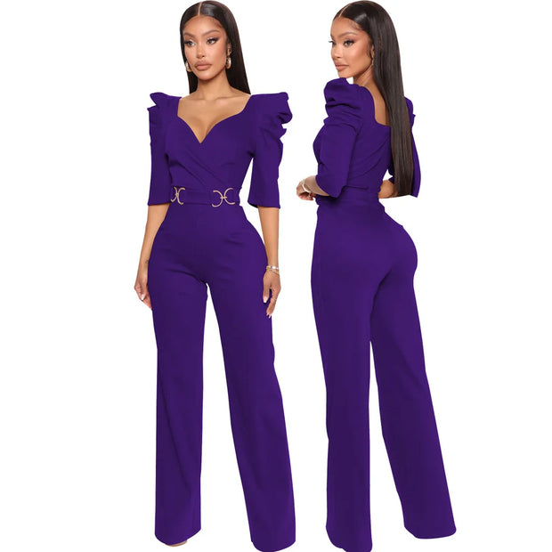 Purple jumpsuit worn by a model on a white background
