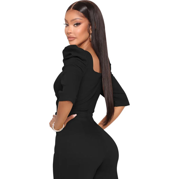 Woman wearing a black outfit on a white background