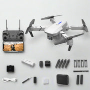 white Drone with remote control, camera, and accessories on a white background