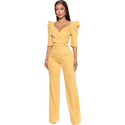 Yellow jumpsuit worn by a model on a white background