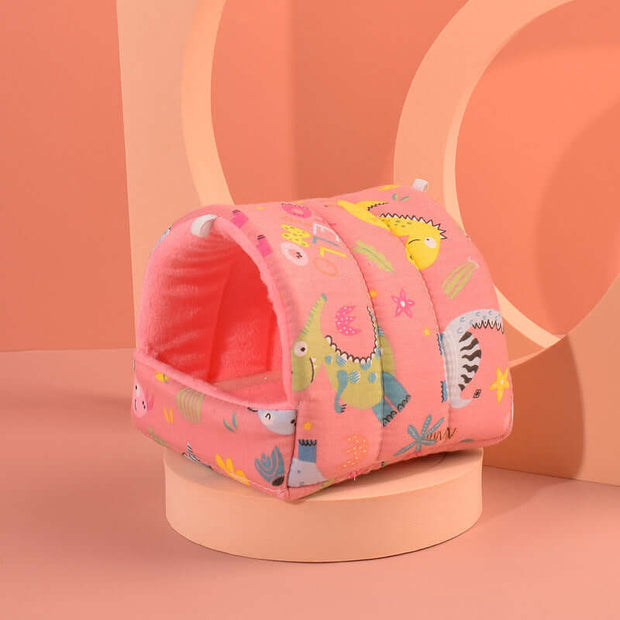 Pink pet bed with animal pattern on a peach-colored background