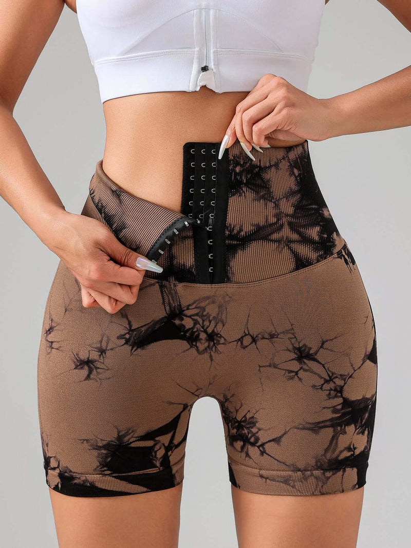 Woman wearing Tie Dye Sports Shorts s, showcasing a high waist and stylish design for a flattering fit.