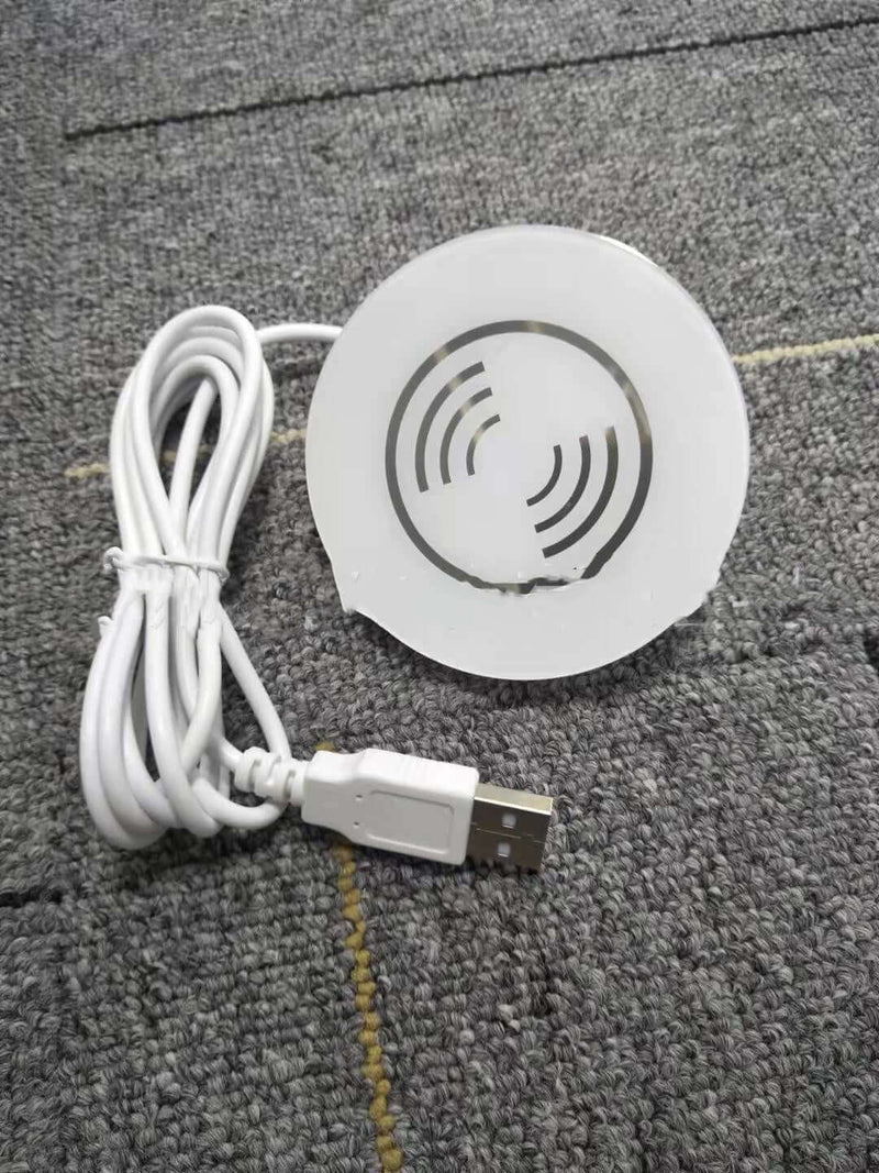 Small electronic device with USB cable on a textured surface