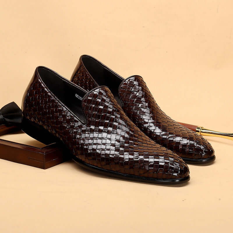 Brown woven dress shoes on a beige background