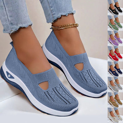 Blue slip-on shoes with white soles worn by a person, with additional color options displayed on the right.