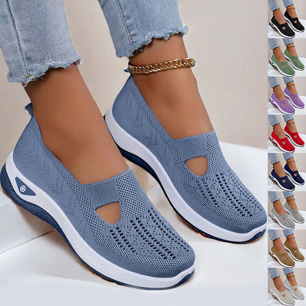 Blue slip-on shoes with white soles worn by a person, with additional color options displayed on the right.