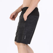 Black athletic shorts with a brand logo on a white background