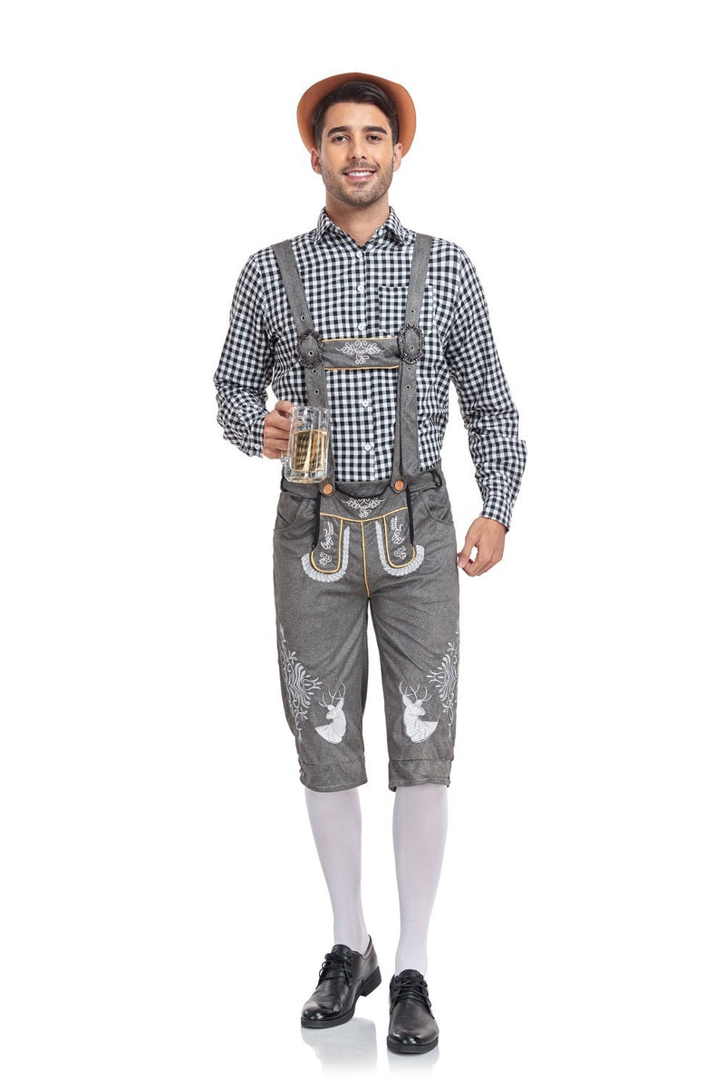Man wearing traditional Bavarian lederhosen and hat holding a beer mug on a white background