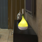 Yellow diffuser on a shelf with a blurred background