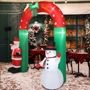 Inflatable Christmas arch with Santa Claus and snowman decorations in a festive setting.