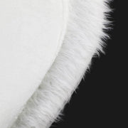 Close-up of a white fur trim on a black background