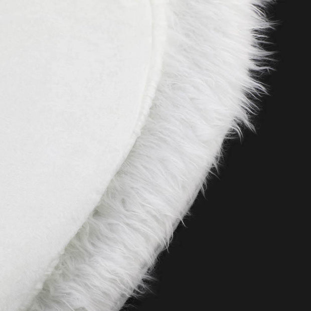 Close-up of a white fur trim on a black background