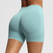 Light blue athletic shorts worn by a person on a plain background