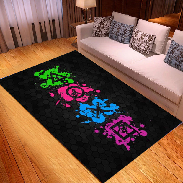 Black rug with colorful symbols on a wooden floor in a living room.
