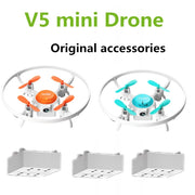 V5 mini Drone with original accessories on a white background