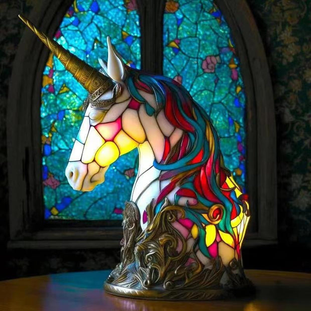 Colorful unicorn lamp with stained glass design in the background