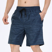 Blue shorts with a drawstring on a white background