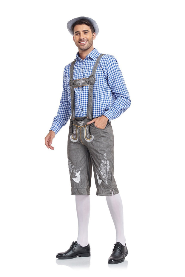 Man wearing traditional Bavarian lederhosen and checkered shirt on a white background