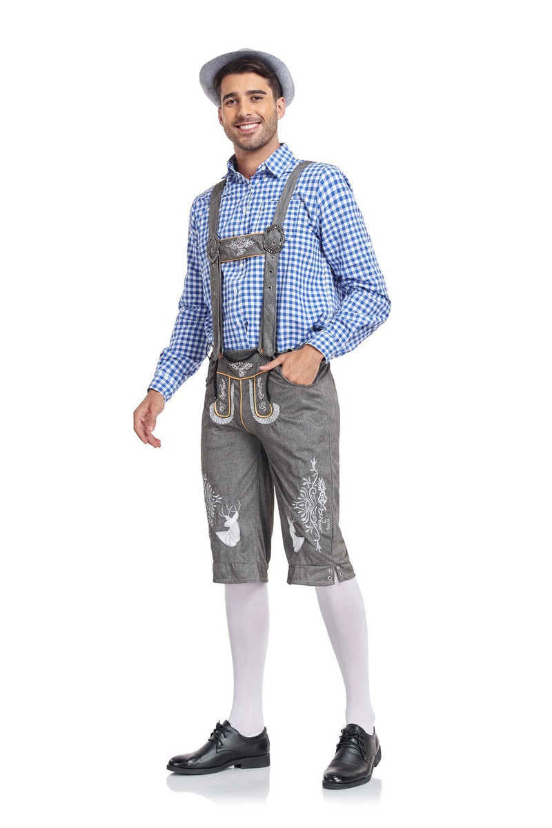 Man wearing traditional Bavarian lederhosen and checkered shirt on a white background
