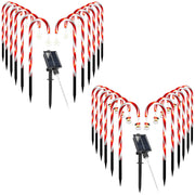 Solar-powered candy cane lights on white background