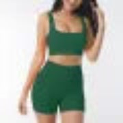 Green shorts with a matching top on a plain background