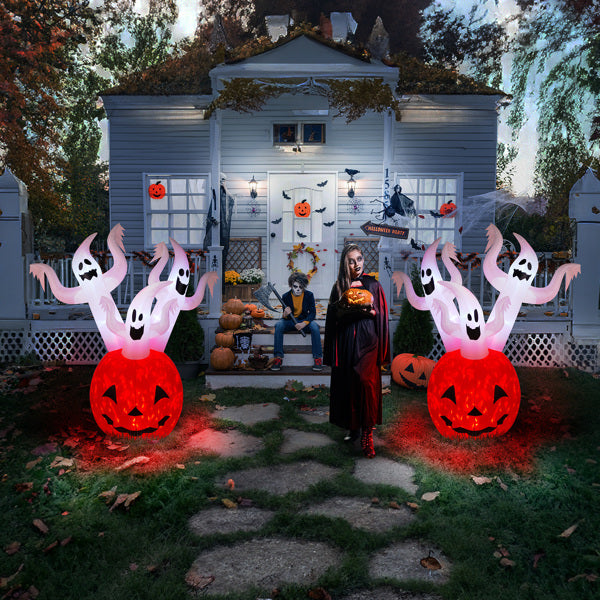Halloween-themed outdoor scene with inflatable ghosts and pumpkins in front of a decorated house.